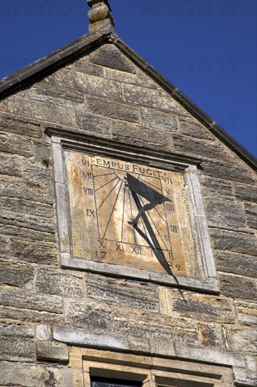 England, West Sussex, East Grinstead, Sackville College a former Alms house sandstone built with sundail over the entrance.