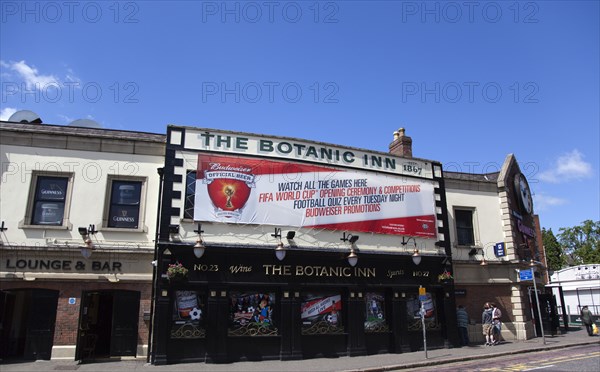 Ireland, North, Belfast, Malone Road, Exterior of the Botanic Inn bar with world cup banner on the building.