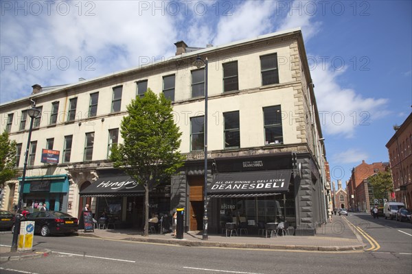 Ireland, North, Belfast, Bedford street, people sat outside Deane's Deli and Vincafe.