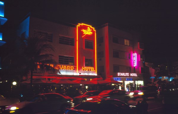 Miami, Florida, USA. South Beach Ocean Drive Art Deco buildings at night Boulevard & Starlite hotels with neon signs. Nite North America Sand Sandy Beaches Tourism Seaside Shore Tourist Tourists Vacation Southern Sunshine State United States of America