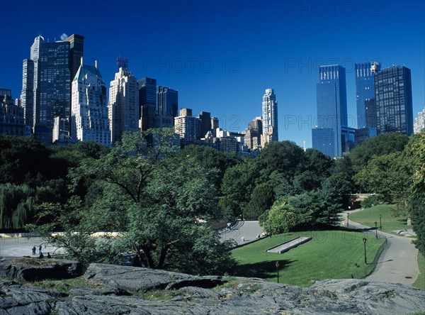 New York City, New York, USA. Central Park with city skyline of 5th Avenue beyond American Blue Citiscape Building Buildings Urban Architecture North America Northern United States of America