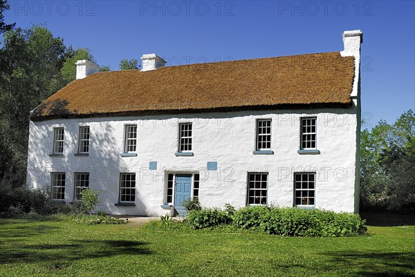 Omagh, County Tyrone, Ireland. Ulster American Folk Park The Campbell House originally built in 1786. Ireland Irish Eire Erin Europe European North Northern County Tyrone Omagh Ulster American US Folk Park Museum Living Tour Tourism Tourist Attraction Travel Architecture House Home Exterior White Whitewashed Campbell Blue Sky Color Destination Destinations History Historic Northern Europe Poblacht na hEireann Republic Sightseeing Tourists Colour Holidaymakers