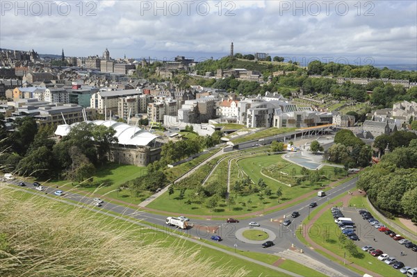 Edinburgh, Lothian, Scotland. Holyrood View over the new Scottish Parliament Builldings designed by Enric Miralles with Calton hill behind. Scotland Scottish Great Britain UK GB United Kingdom Edinburgh Lothian Architecture Modern Politics Political Parliament Building Buildings Architecture Exterior Government Offical Europe European Capital Holyrood Green Grass Rooves Roof Grass Roof Aerial Calton Hill Dynamic Earth Centre Center Living Alba British Isles Color Great Britain Northern Europe Parliment United Kingdom Colour