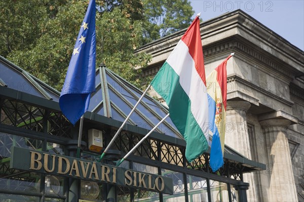 Budapest, Pest County, Hungary. Siklo Funicular Buda funicular railway station with EU Hungary and Budapest flags above name sign. Hungary Hungarian Europe European East Eastern Buda Pest Budapest City Architecture Signs Funicular Railway Station Exterior Entrance Flags Destination Destinations Eastern Europe European Union Signs Display Posted Signage