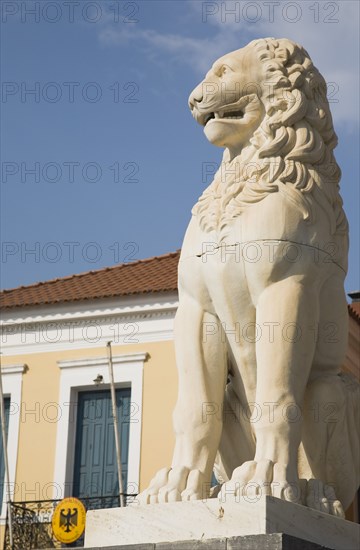 Samos Island, Northern Agean, Greece. Vathy. Lion statue in Pythagoras Square set up in 1930 to mark the centenary of the uprising against the ottoman Turkish overlords. Greece Greek Europe European Vacation Holiday Holidays Travel Destination Tourism Ellas Hellenic Northern Aegean Samos Vathy Lion Statue Art Carved Pythagoras Square Architecture Blue Sky Destination Destinations Ellada Southern Europe