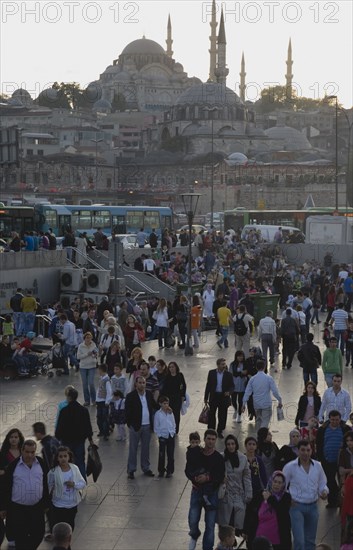 Istanbul, Turkey. Sultanahmet. Early evening crowds in front of Suleymaniye Mosque. Turkey Turkish Istanbul Constantinople Stamboul Stambul City Europe European Asia Asian East West Urban Destination Travel Tourism Sultanahmet Sulemaniye Mosque Architecture Muslim Moslem Islam Islamic Minaret Minarets Dome People Crowd Crowds Destination Destinations Middle East Religion Religion Religious Muslims Islam Islamic South Eastern Europe Turkiye Warm Light Western Asia