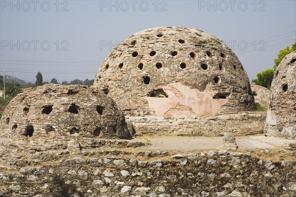 Selcuk, Izmir Province, Turkey. Domed burial chambers at ancient site of the Temple of Artemis. Turkey Turkish Eurasia Eurasian Europe Asia Turkiye Izmir Province Selcuk Domed Burial Chambers Ancient Architecture Destination Destinations European History Historic Middle East Religion South Eastern Europe Western Asia