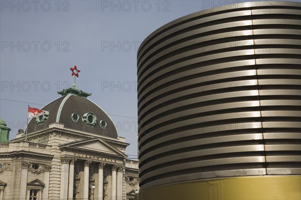 Vienna, Austria. Neubau District of Vienna. The Volkstheater. Part view of exterior facade seen behind modern circular structure. Austria Austrian Republic Vienna Viennese Wien Europe European City Capital Neubau District Volkstheater Architecture Building Modern Exterior Facade Old Traditional Classic Classical Destination Destinations Historical Older Osterreich Viena Western Europe