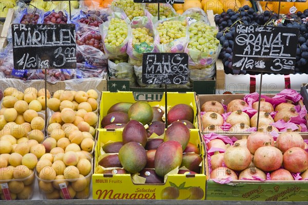 Vienna, Austria. The Naschmarkt. Display of fresh fruit for sale including apricots grapes and mangoes. Austria Austrian Republic Vienna Viennese Wien Europe European City Capital Naschmarkt Market Display Fresh Food Fruit Vegetables Veg Vegetable Stall Shop Store Destination Destinations Osterreich Viena Western Europe