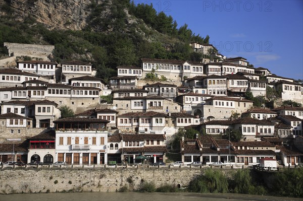 Berat, Albania. Houses built on hillside on the banks of the River Osum. Albanian Shqip‘ria Southern Europe Albania Albanian Republic Europe European Travel Destination Indo European Berat River Osum Banks Hillside Architecture Houses Housing Urban Water Homes Blue Destination Destinations