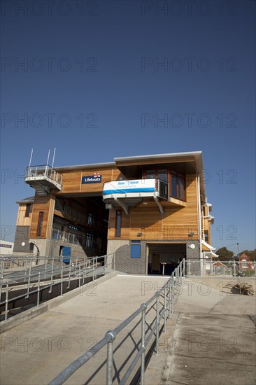 Shoreham-by-Sea, West Sussex, England. Kingston Beach Newly constructed lifeboat house opposite the harbour entrance. England English West Sussex County Shoreham Shoreham-by-Sea by Sea Water Kingston Beach Europe European Architecture Modern Life Boat Lifeboat Lifeboats RNLI Wood Wooden Clad Galvanised Metal Zinc Blue Sky Station Home Timber Frame
