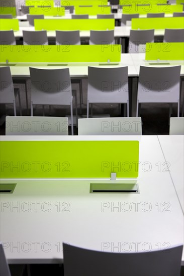 Dublin, County Dublin, Ireland. Ballsbridge Lansdowne Road Aviva Football stadium Detail of the Press Room. Ireland Republic Eire Europe European Dublin Baile Atha Cliath Capital City Ballsbridge Suburb South Lansdowne Road Stadium Sport Sports Venue Ground Home National Ball Football Soccer Rugby Architecture Aviva Interior Inside Press Room Reporters Chairs Tables