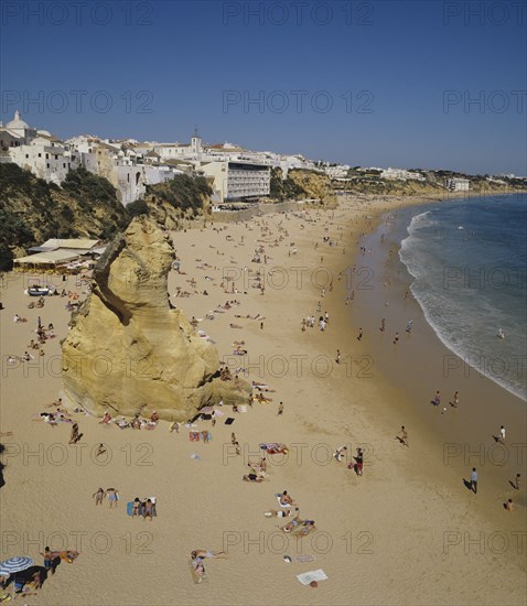 Albufeira, Algarve, Portugal. Fishermans beach. Portugal Portuguese European Europe Algarve Albufeira Beach Travel Tourism Fisherman Shore Water Sand Holiday Coast Vacation Blue Destination Destinations Holidaymakers Portugese Sand Sandy Beaches Tourism Seaside Shore Tourist Tourists Vacation Southern Europe Sunbather