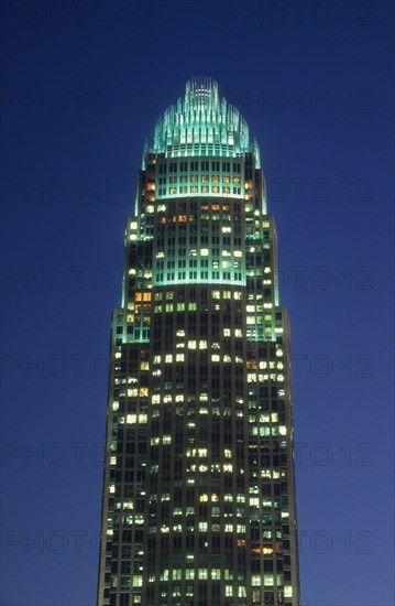 Charlotte, North Carolina, USA. Bank of America headquarters illuminated at night. America Architectural Architectural Feature Architecture Bank Of America Bank Of America Plaza Building Buildings Charlotte Cities City Dusk Evening High Rise High Rises High-rise High-rises Illuminated Night Night time Night-Time No One No People Nobody North Carolina Outdoors Outside Skyscraper Skyscrapers US USA United States Urban Vertical bank banking nc tower 1 American Nightfall Twilight Evenfall Crespuscle Crespuscule Gloam Gloaming North America North Carolina First in Flight Northern Single unitary United States of America Warm Light