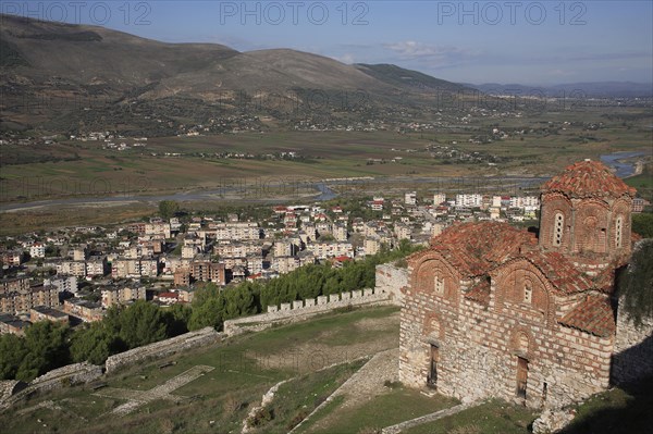 Berat, Albania. St Triada Church on the right with Berat new town beside the River Osum in the background. Albanian Shqip‘ria Southern Europe Albania Albanian Republic Europe European Travel Destination Indo European Berat River Osum Town Church St Saint Triada Church Christian Christianity Byzantine Religion Religious Landscape Floodplain Destination Destinations Religion Religious Christianity Christians Scenic