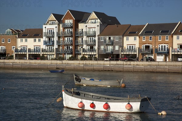 Shoreham-by-Sea, West Sussex, England. Ropetackle riverside housing developement on former industrial site. England English UK United Kingdom GB Great Britain British Europe European West Sussex County Shoreham Shoreham-by-Sea by Sea River Arun Water Waterside Modern Apartment Apartments Flat Flats Architecture Ropetackle Brown Field Development Site Boat Boats Blue Sky