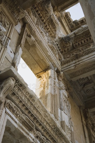 Selcuk, Izmir Province, Turkey. Ephesus. Detail of carved wall and ceiling of building in ancient city of Ephesus on the Aegean sea coast. Turkey Turkish Eurasia Eurasian Europe Asia Turkiye Izmir Province Selcuk Ephesus Ruin Ruins Roman Facde Ancient Architecture Masonry Rock Stone Destination Destinations European History Historic Middle East South Eastern Europe Water Western Asia