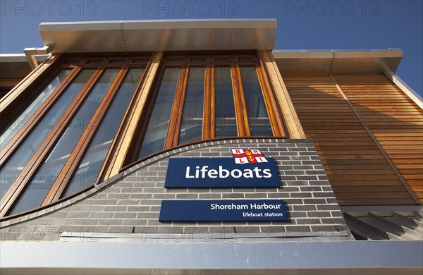 Shoreham-by-Sea, West Sussex, England. Kingston Beach Newly constructed lifeboat house opposite the harbour entrance. England English West Sussex County Shoreham Shoreham-by-Sea by Sea Water Kingston Beach Europe European Architecture Modern Life Boat Lifeboat Lifeboats RNLI Wood Wooden Clad Galvanised Metal Zinc Blue Sky Station Home Timber Frame