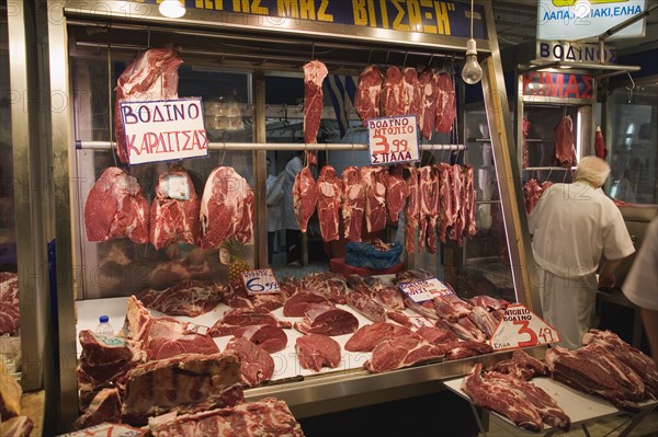 Athens, Attica, Greece. Central Market Display of meat on butchers stall in covered market. Greece Greek Europe European Vacation Holiday Holidays Travel Destination Tourism Ellas Hellenic Attica Athens Central Market Meat Beef Butcher Butchers Food Stall Shop Store Display Price Prices Vendor Vendor Atenas Athenes Color Destination Destinations Ellada Southern Europe