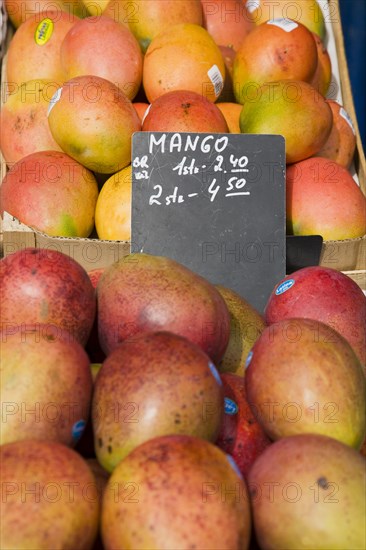 Vienna, Austria. Mangoes for sale on market stall. Austria Austrian Republic Vienna Viennese Wien Europe European City Capital Naschmarkt Market Display Fresh Food Fruit Stall Shop Store Destination Destinations Osterreich Viena Western Europe