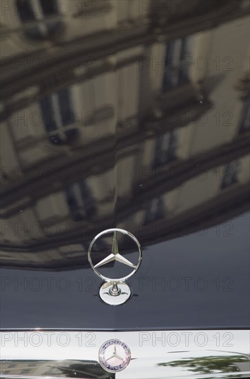 Vienna, Austria. Building facade reflected in bonnet of Mercedes car. Austria Austrian Republic Vienna Viennese Wien Europe European City Capital Car Auto Automobile Bonnet Hood paint Paintwork Bodywork Reflect Reflection Reflected Buildings Architecture Mercedes benz Three Pointed Star Logo Emblem Badge 3 Automotive Autom—vil Cars Color Destination Destinations Motorcar Osterreich Reflexion Viena Western Europe