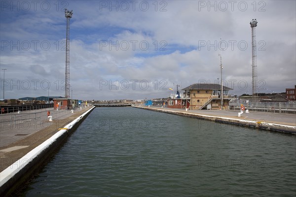 Shoreham-by-Sea, West Sussex, England. Harbour entrance water filled lock. England English UK United Kingdom GB Great Britain British Europe European West Sussex County Shoreham Shoreham-by-Sea By Sea Southwick Brighton Port Harbour Harbor Entrance Lock Quay Waterway Lagoon Transport Sea Water Ships Shipping Boats