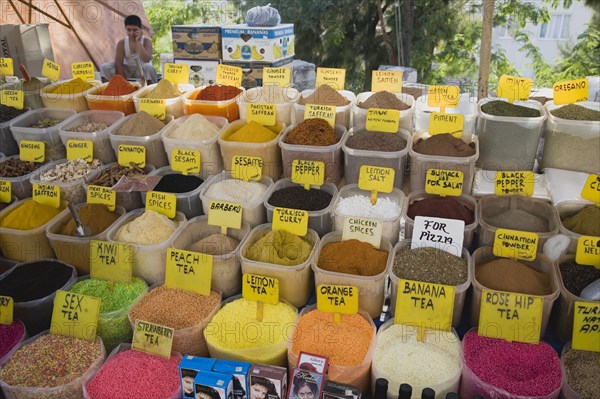 Kusadasi, Aydin Province, Turkey. Stall at weekly market selling spices and tea powders in brightly coloured display. Asian Colored Destination Destinations European Middle East South Eastern Europe Turkish Turkiye Western Asia