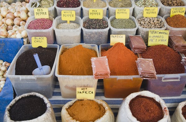 Kusadasi, Aydin Province, Turkey. Stall at weekly market selling spices and chili powders in brightly coloured display. Turkey Turkish Eurasia Eurasian Europe Asia Turkiye Aydin Province Kusadasi Market Markets Stall Display Spice Spices Powder Tea Dried Multi Muliple Color Colour Colors Colours Colored Coloured Chilli Destination Destinations European Middle East South Eastern Europe Western Asia