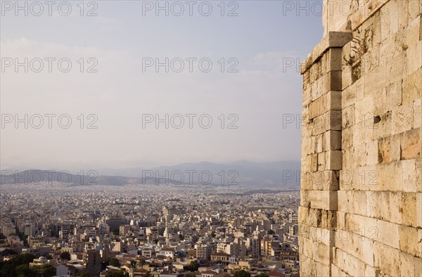 Athens, Attica, Greece. View across city from the Acropolis Propylaea gate to Mount Parnitha to the north. Greece Greek Europe European Vacation Holiday Holidays Travel Destination Tourism Ellas Hellenic Athens Attica Mount Mount Parnitha Aerial Propylaea Gate View City Architecture Rooftops Rooftops Housing Streets Streets Atenas Athenes Destination Destinations Ellada History Historic Northern Southern Europe
