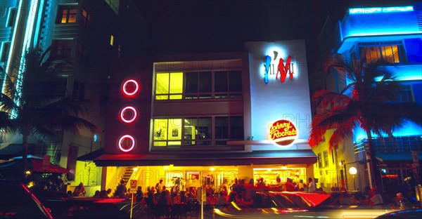 Miami, Florida, USA. South Beach Ocean Drive Art Deco Buildings at night Johnny Rockets restaurant . Nite North America Sand Sandy Beaches Tourism Seaside Shore Tourist Tourists Vacation Southern Sunshine State United States of America