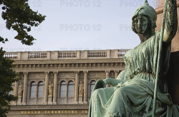 Budapest, Pest County, Hungary. Empire era bronze statue outside the Hungarian Academy of Sciences. Hungary Hungarian Europe European East Eastern Buda Pest Budapest City Art Architecture Empire Bronze Statue Green Academy Sciences Building Facade Destination Destinations Eastern Europe History Historic