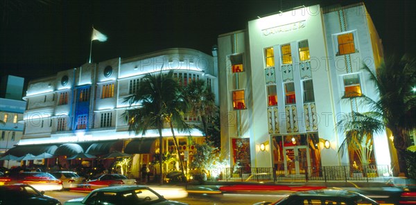 Miami, Florida, USA. South Beach Ocean Drive Art Deco Buildings at night Cavalier & Cardozo Hotels illuminated . Nite North America Sand Sandy Beaches Tourism Seaside Shore Tourist Tourists Vacation Southern Sunshine State United States of America