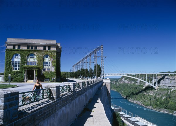 Niagara, Ontario, Canada. Hydro Electric Power Station and bridge to the United States. HEP American Blue Canadian Destination Destinations Ecology Entorno Environmental Environnement Green Issues Holidaymakers North America Northern One individual Solo Lone Solitary Tourism Tourist