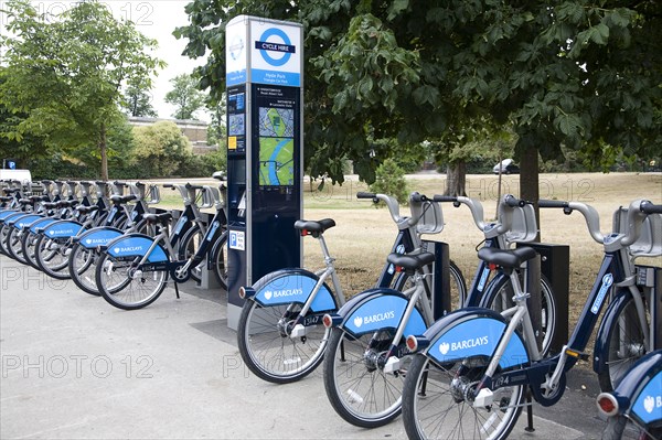 London, England. Hyde Park Barclays Bank sponsored Bikes For Hire. England English London UK United Kingdom British GB Great Britain Europe European Transport Urban Green Bicycle Bicycles Bike Bikes Push Pedal Environment Rent Hire Loan Borrow Barclays Bank Sponsored Boris Johnson Boriss Bikes TFL Docking Station Terminal Pay Public Park Parked British Isles Ecology Entorno Environmental Environnement Great Britain Green Issues Londres Northern Europe United Kingdom