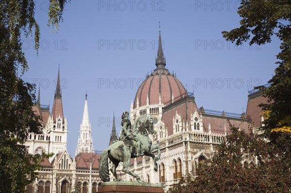 Budapest, Pest County, Hungary. Equestrian statue of Francis II Rakoczi leader of the Hungarian uprising against the Habsburgs 1703 to 1711 outside the Parliament Building. Hungary Hungarian Europe European East Eastern Buda Pest Budapest City Urban Architecture Parliament Building Art Statue Equestrian Francis II Rakoczi Blue Sky Destination Destinations Eastern Europe Parliment