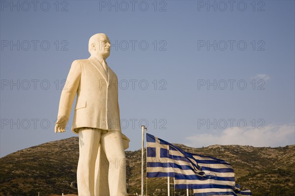 Samos Island, Northern Aegean, Greece. Vathy. Statue of Themistoklis Sophoulis head of coalition government of all centrist and rightist parties. Greece Greek Europe European Vacation Holiday Holidays Travel Destination Tourism Ellas Hellenic Northern Agean Samos Island Vathy Architecture Art Statue Stone Carved Man Male Figure Themistoklis Sophoulis Flag Flags Destination Destinations Ellada Male Men Guy Southern Europe
