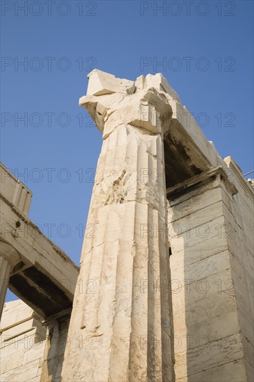 Athens, Attica, Greece. Acropolis Propylaea gate against clear blue summer sky from low viewpoint looking upwards. Greece Greek Europe European Vacation Holiday Holidays Travel Destination Tourism Ellas Hellenic Athens Attica Acropolis Propylaea View Architecture Ruin Ruins Column Columns Blue Sky Atenas Athenes Destination Destinations Ellada History Historic Southern Europe