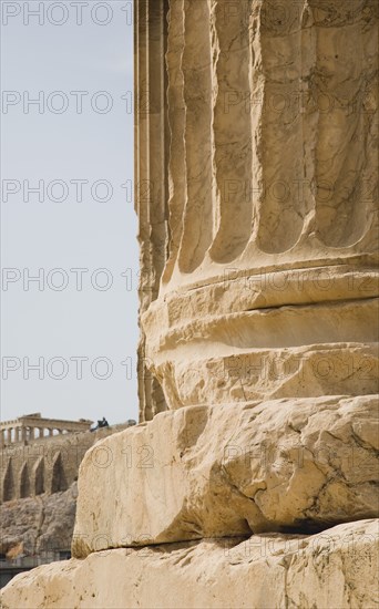 Athens, Attica, Greece. Base of ruined column on The Temple of Olympian Zeus with Parthenon and Acropolis behind. Greece Greek Attica Athens Europe European Vacation Holiday Holidays Travel Destination Tourism Ellas Hellenic Acropolis Parthenon Temple Olympian Zeus Ruin Ruins Column Columns Atenas Athenes Destination Destinations Ellada History Historic Southern Europe