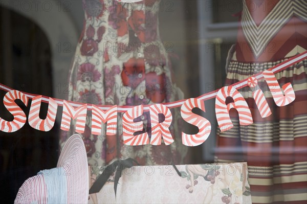 Vienna, Austria. Sale sign in dress shop window spelt SAIL. Austria Austrian Republic Vienna Viennese Wien Europe European City Capital Sign Shop Store Market Clothes ClothingWindow Display Sale Sail Dress Dresses Summer Destination Destinations Osterreich Signs Display Posted Signage Viena Western Europe