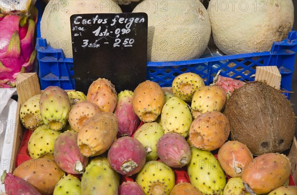 Vienna, Austria. The Naschmarkt. Melon prickly pears and coconut for sale in display on market fruit stall. Austria Austrian Republic Vienna Viennese Wien Europe European City Capital Naschmarkt Market Display Fresh Food Fruit Stall Shop Store Coconut Catus Prickly Pear Pears Destination Destinations Osterreich Viena Western Europe