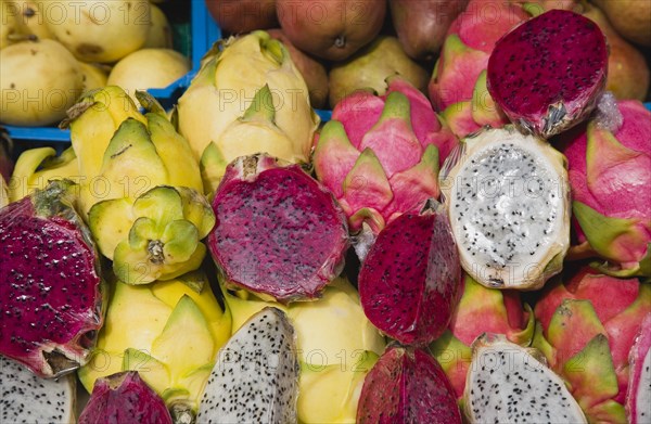 Vienna, Austria. The Naschmarkt. Exotic fruit for sale on market stall. Genus Hylocereus sweet pitayas commonly known as dragon fruit. Austria Austrian Republic Vienna Viennese Wien Europe European City Capital Naschmarkt Market Display Fresh Food Fruit Stall Shop Store Dragon Color Destination Destinations Osterreich Viena Western Europe