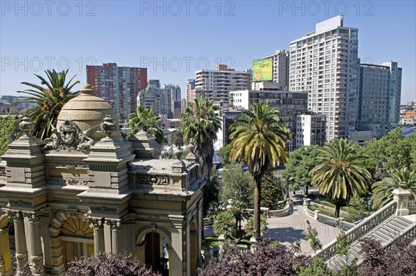 Santiago, Chile. The classical lines of the Neptune Terrace at the Cerro Santa Lucia with Chilean Palm trees and highrise apartment blocks in downtown Santiago Chile Chilean South America American Hispanic Santiago City Cityscape Urban Neptune Terrace Trees Tree Palm Santa Lucia Cerro Flats Towers Blocks Block Apartments Apartment Highrise Caribbean Destination Destinations Flat Latin America Latino South America Southern Windward Islands