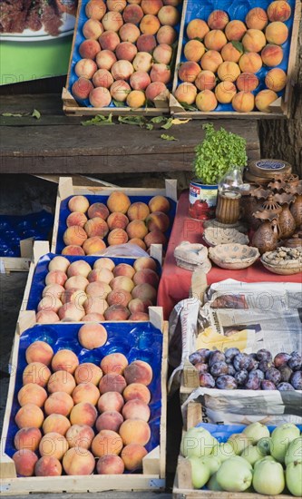 Sirince, Aydin Province, Turkey. Fruit stall selling fresh local peaches or Seftali in Turkish plums and apples. Turkey Turkish Eurasia Eurasian Europe Asia Turkiye aydin province Sirince Market Markets Fruit Fruits Peach Peaches Seftali PLum Plums Apple Apples Destination Destinations European Middle East South Eastern Europe Western Asia