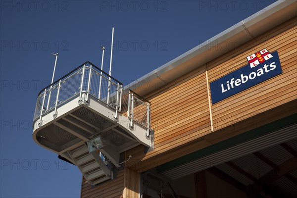 Shoreham-by-Sea, West Sussex, England. Kingston Beach Newly constructed lifeboat house opposite the harbour entrance. England English West Sussex County Shoreham Shoreham-by-Sea by Sea Water Kingston Beach Europe European Architecture Modern Life Boat Lifeboat Lifeboats RNLI Wood Wooden Clad Galvanised Metal Zinc Blue Sky Station Home Timber Frame