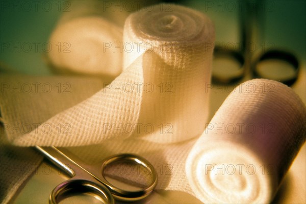 Still life of Hemostat and gauze bandage. Accuracy Accurate Bandage Bandages Clean Cleanliness Close Up Close-Up Gauze Health Healthcare Hemostat Hemostats Hygiene Hygienic Medicine No One No People Nobody Precise Precision Scissor Scissors Studio Studio Shot doctor doctors office medical still life tools 1 Single unitary