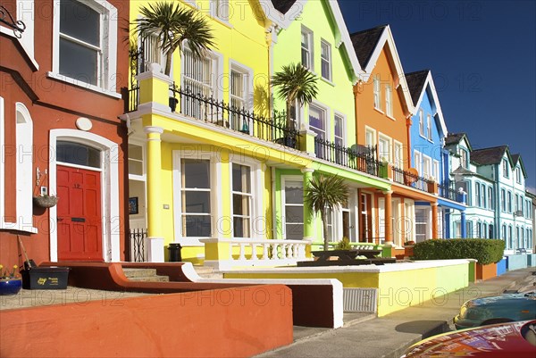 Whitehead, County Antrim, Ireland. Colourfully painted terraced houses with balconies. Ireland Irish Eire Erin Europe European Ulster North County County Antrim Whitehead Color Colorful Colored Colour Colourful Coloured Terrace Terraced House Houses Home Homes Architecture Balcony Balconies Blue orange Yellow Green Destination Destinations Northern Northern Europe Poblacht na hEireann Republic