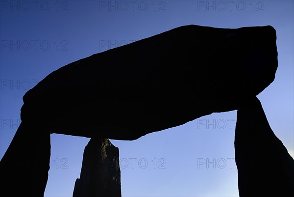 Legananny, County Down, Ireland. Mourne Foothills Legananny Dolmen feature of the Neolithic Age 5000 years ago. Ireland Irish Eire Erin Europe European Ulster North Northern County Down Mourne District Legananny Domen Neolithic Stone Blue Sky Silhouette Silhouetted Color Destination Destinations History Historic Northern Europe Poblacht na hEireann Religion Republic Solid Outline Shade Silhouette Solid Outline Shade Silhouetted Colour Religious