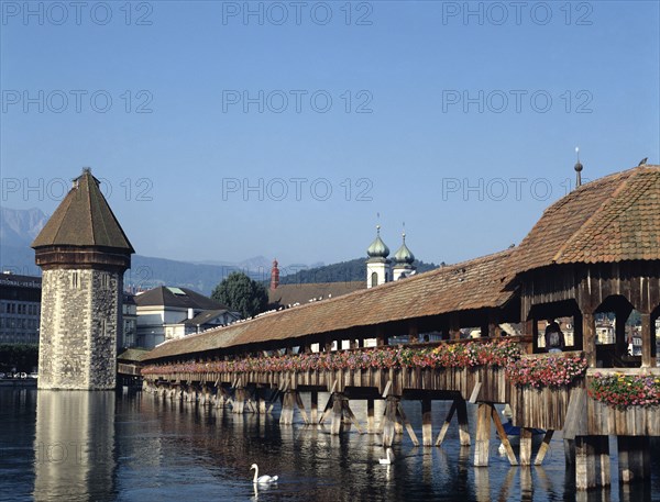 Lucerne, Switzerland. Chapel Bridge. Switzerland Swiss Lucerne Lucerna Luzern Lake Water Bridge Chapel Wood Wooden Blue Sky Swan Swans Europe European City Toursim Tour Travel Destination Destinations Schweiz Suisse Svizzera Western Europe