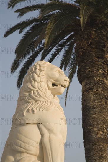 Samos, Northern Aegean, Greece. Vathy. Lion statue in Pythagoras Square set up in 1930 to mark the centenary of the uprising against the Ottoman Turkish. Greece Greek Europe European Vacation Holiday Holidays Travel Destination Tourism Ellas Hellenic Northern Agean Island Vathy Vathy Architecture Art Statue Stone Carved Lion Pythagoras Square Destination Destinations Ellada History Historic Southern Europe