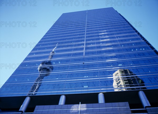 Toronto, Ontario, Canada. The CN Tower reflected in Front Street glass fronted building Canadian National American Blue Destination Destinations North America Northern